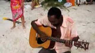 Crazy guy sings songs on Seychelles Beach