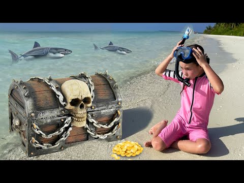 صوفيا وماكس يلعبان على الشاطئ مع ألعاب الأطفال 