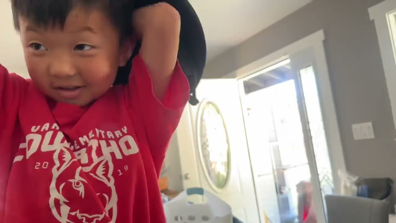 20250530 Max trying amazon sun hat