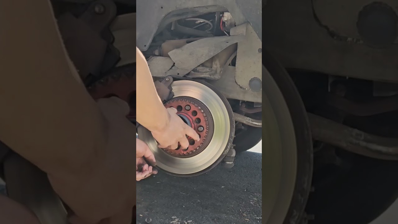 changing 83 Cadillac tire  