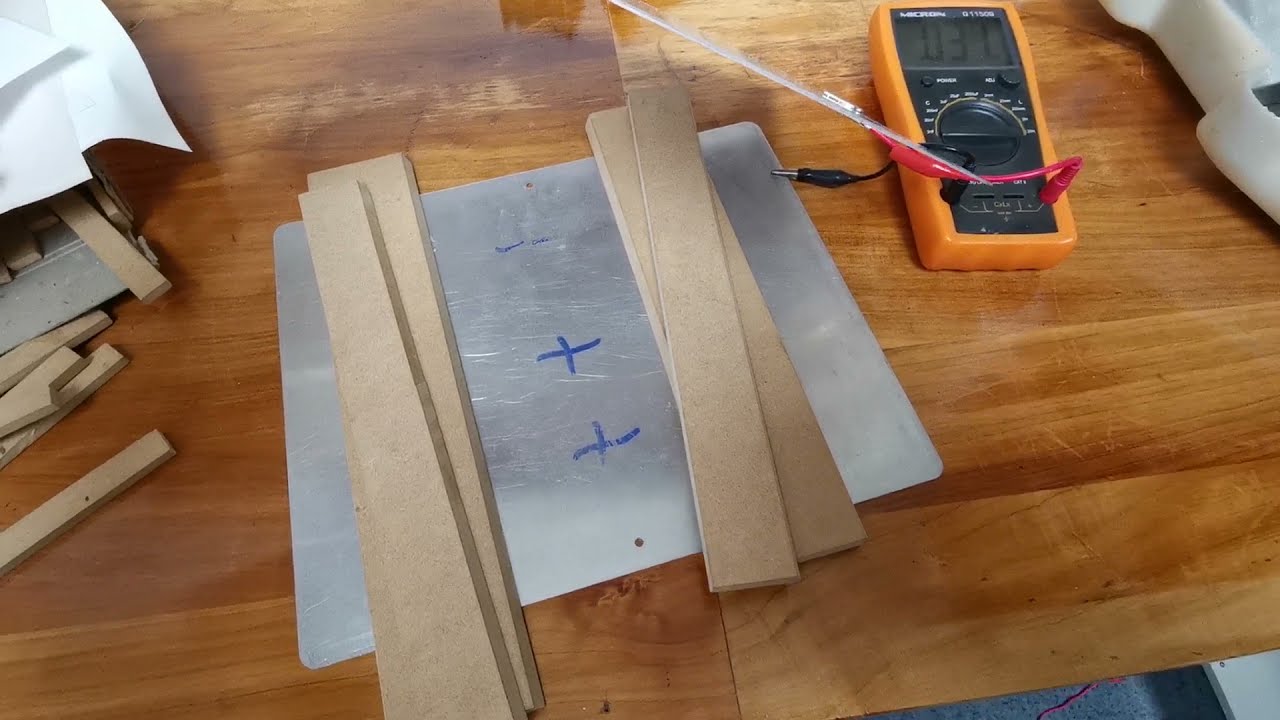 Making capacitors using metal plates (or tin foil) and paper