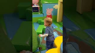 Having fun playing with water patterns at soft play