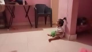 11th months baby boy playing cricket with his brother
