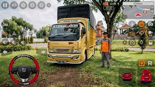 A Truck with a Swerving Canter and a Driver Ready to Go | Bus Simulator Indonesia Mod screenshot 1