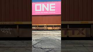 CN 5777, 5612 tow Westbound intermodal containers in well cars of TTX, Burlington Northern Santa Fe