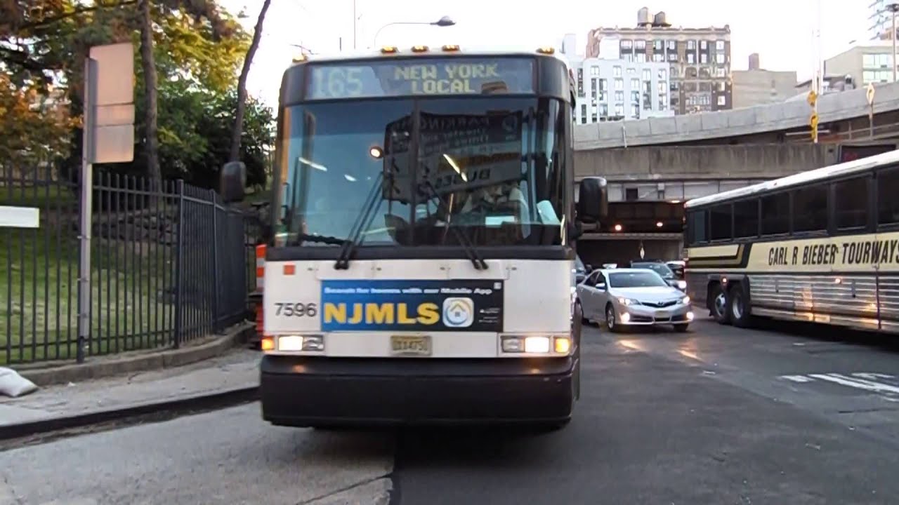 COACH USA MCI 13299 D4500CT AND NEW JERSEY TRANSIT MCI D4000 BUS 7596