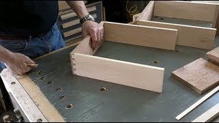 I use a Leigh dovetail jig to cut half blind dovetails in the drawer sides, and assemble the drawers. Then its time to fit each drawer to 