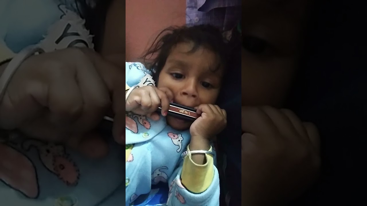 baby playing mouth organ YouTube