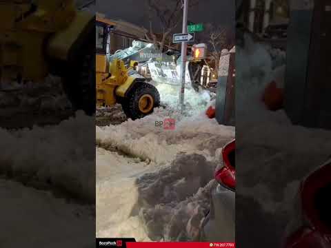 Tractors cleared bus stop on 56th Street off 11th Avenue to keep NYC transit moving.