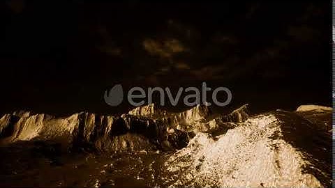 Dark Clouds Over Volcanic Valley with Grass and Rocks | Motion Graphics - Envato elements