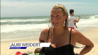 Surfer recovering after run-in with shark off Surf City