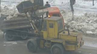 Old soviet loader TO-30 loadin dirt snow