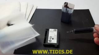 Remplisage d´une cartouche d´encre HP 933 pour imprimante - Texte en francais