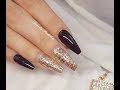 Rebalance Salon coffin gel nails with black gel polish and encapsulated glitter