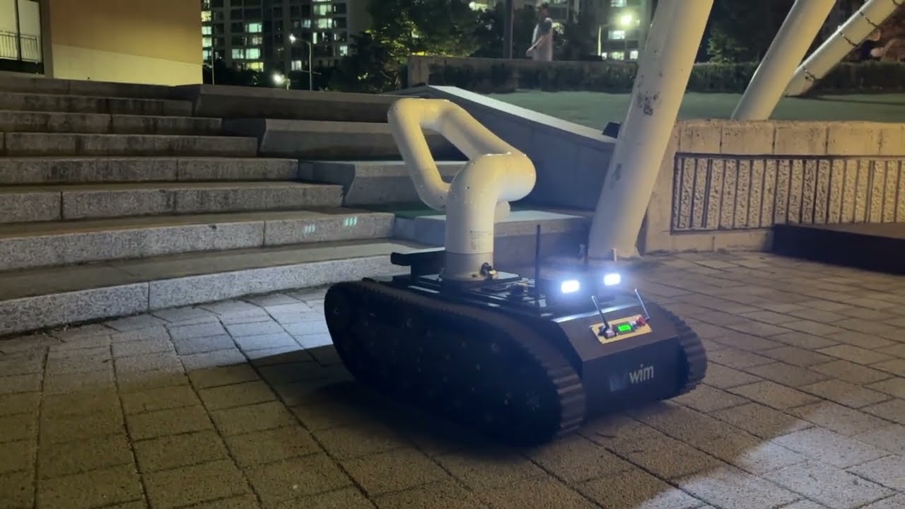 WIM robot arm that climbs stairs: tracked mobile manipulator (night field test)