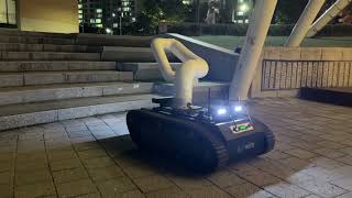 WIM robot arm that climbs stairs: tracked mobile manipulator (night field test)