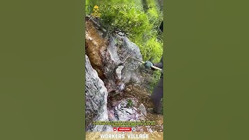 worker is breaking a large rock using a hammer and chisel. #hardwork #workersvillage #skilledworker