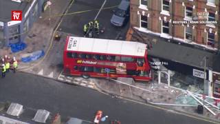 Two trapped after London double-decker bus crashes into building
