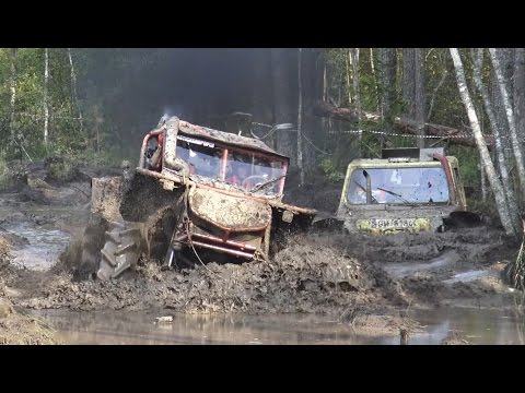 Off-Road vehicle mud race, wet forest.