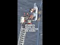 Rollercoaster riders rescued after train becomes stuck at top of hill