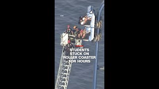Rollercoaster riders rescued after train becomes stuck at top of hill