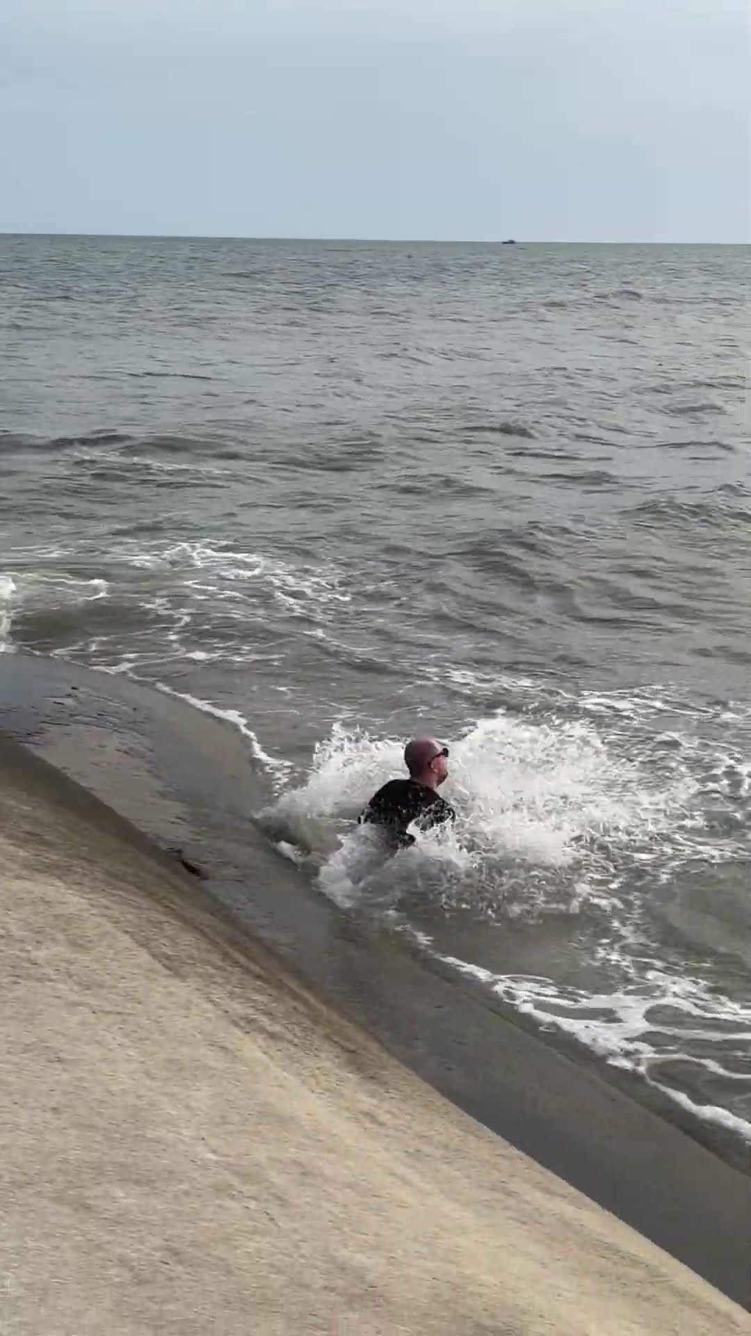 Man Slips On Wet Pavement And Falls Into Sea || ViralHog