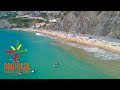 Most beautiful beach in costa vicentinaarrifana beach  praia da arrifana  aljezur  4k ultra.