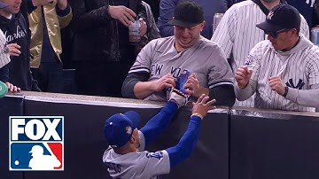 Yankees fan pulls ball out of Mookie Betts