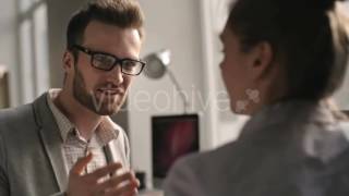 Businessman Talking with Female Coworker - Stock Footage | VideoHive 16683597
