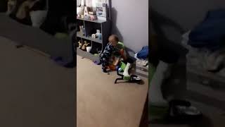 Boy trips and falls when playing with his walker
