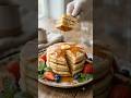 Famous American breakfast. Soft pancakes 🥞 topped with butter and maple syrup.
