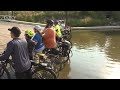 RAGBRAI riders dip their tires in the Missouri at the start of RAGBRAI 2026