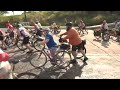 RAGBRAI riders dip their tires in the Missouri at the start of RAGBRAI 2026