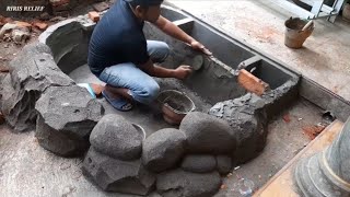 Pembuatan kolam ikan koi dan batu alam
