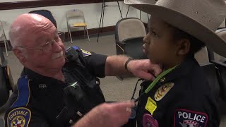 Constable deputy gives badge to Devarjaye Daniel