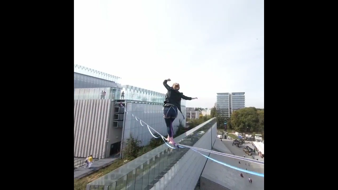 Slackliners Walk Between Buildings in Lublin, Poland - 1352935