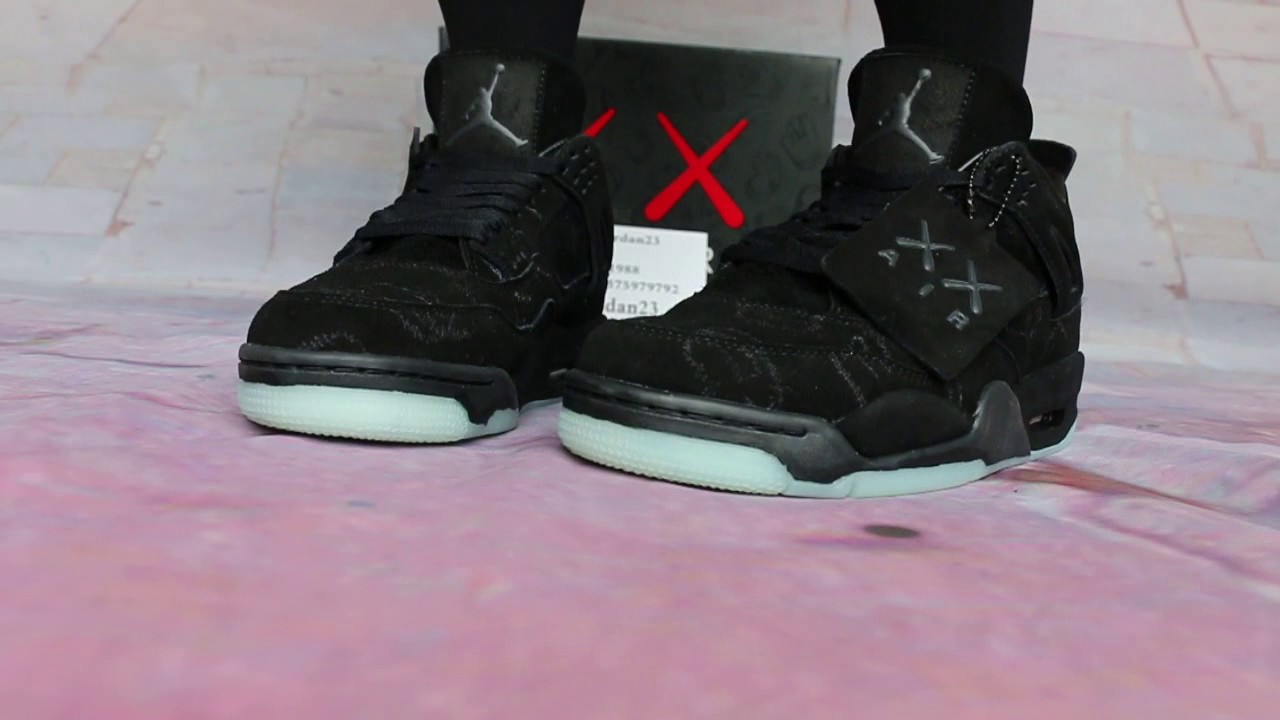 jordan 4 kaws grey on feet