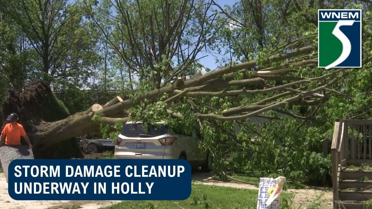 Storm damage cleanup underway in Holly - YouTube