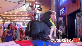 Beauty Girl In Light Green Dress And Her Boyfriend Riding On A Bull In Benidorm |  Bull Riding 4K
