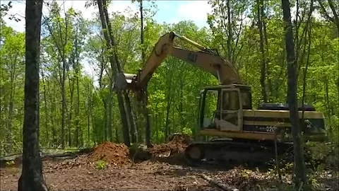 Ozarks Farm; Huge Excavator, Creating Wildlife openings in Big Timber