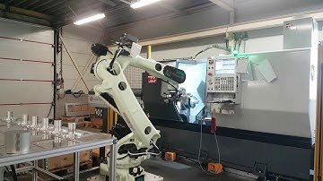 RFA Kawasaki CX210L Robotloader belaadt Haas DS 30Y draaibank bij Uitgeest Mechanische Industrie B.V