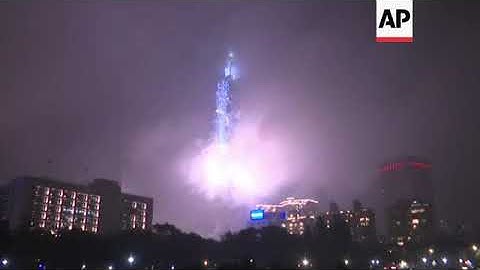 Crowds cheer NYE fireworks at Taipei 101 Tower