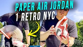 Artist Stretching and Retracting an Air Jordan 1 Retro NYC Sneaker Made Out of Paper