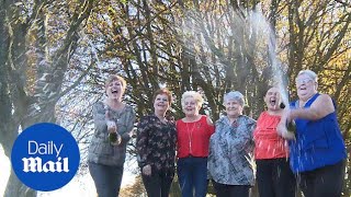 'Catering girls' spray champagne to celebrate lottery win - Daily Mail