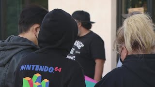 Shoppers line up outside GameStop for PS5