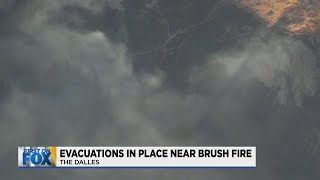 Brush fire prompts evacuations west of The Dalles; fire no longer growing