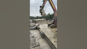 drill and transporting cement block by using excavator