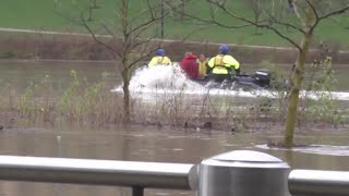 Firefighters rescue 2 people trapped under Ohio bridge by fast-rising river waters