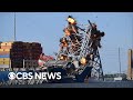 Crews demolish Key Bridge section to free cargo ship