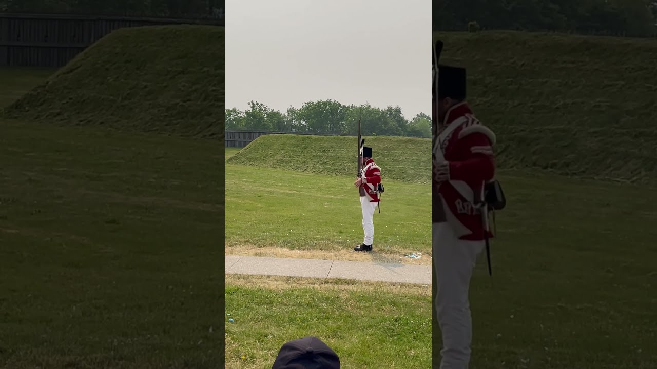 Redcoat Reenactor Quickly Loading And Discharging A Brown Bess Musket Used During Revolutionary War